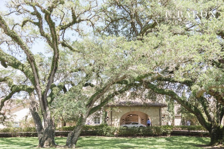 15th century French chapel; C. Baron Photography; Classic; Elegant; Gold; Groom; Houston Oaks Country Club; Houston wedding Photographer; Johanna Terry Events; Lakeside ceremony; Mariachi band; Outdoor Ceremony; PIper and Muse Events; Pink; Sparkler Exit; The Clubs at Houston Oaks; Vintage Rolls Royce; beaded dress; black bowtie; black suit; blush; brunette; first look; flower archway; glasses; greenery; hair piece; half updo; lantern release; outdoor portraits; strapped dress;